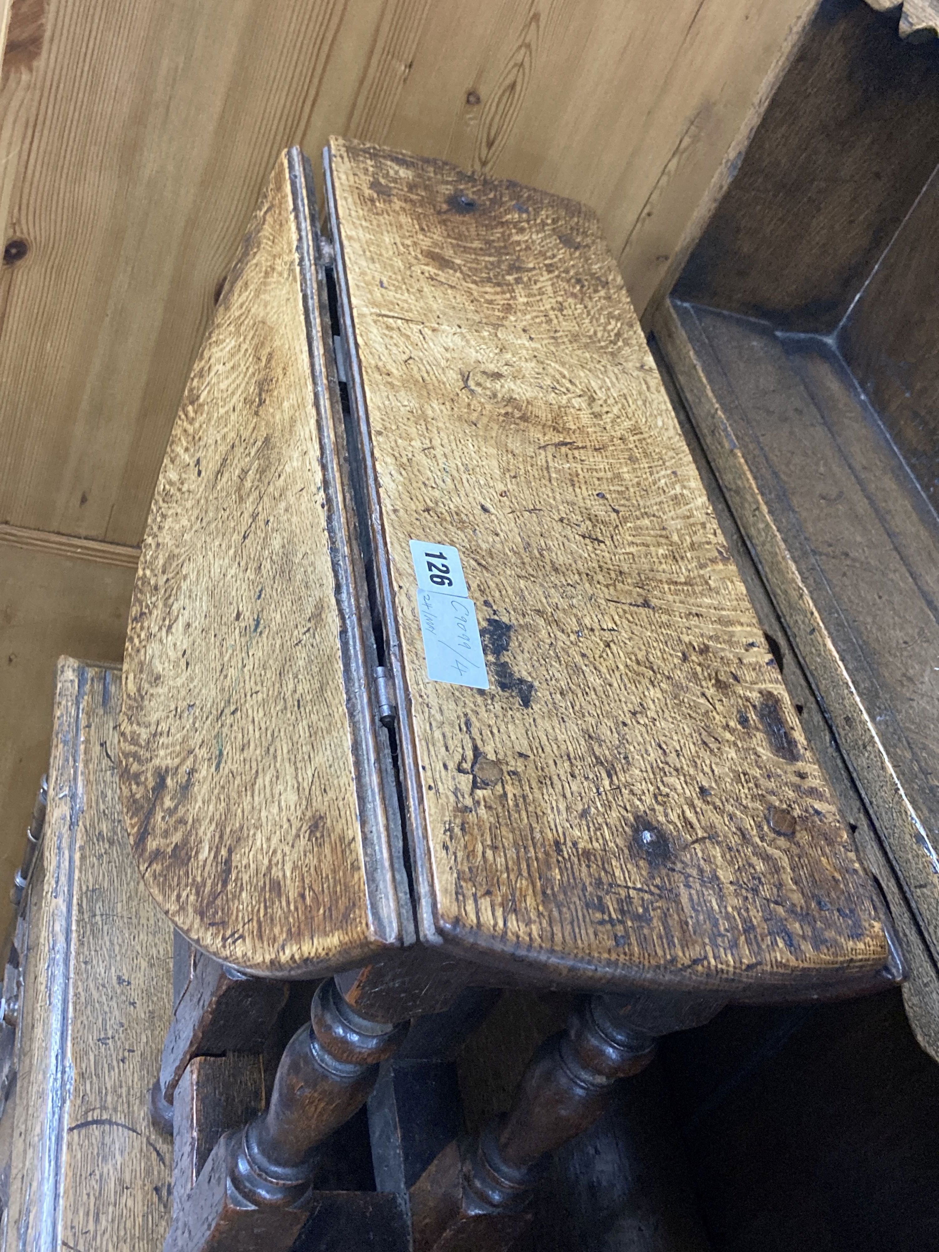 A 19th century miniature oak drop leaf gateleg table with turned supports, height 48cm, top 62 x 48cm